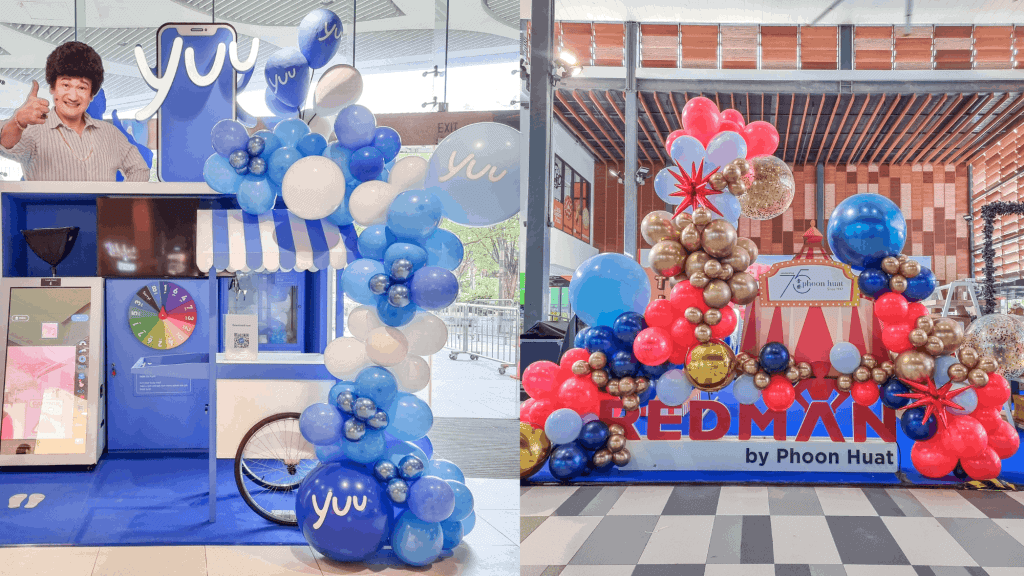corporate-event-planner-singapore-brand-activation-booth Corporate event planner Singapore setting up branded activation booth with balloon decor