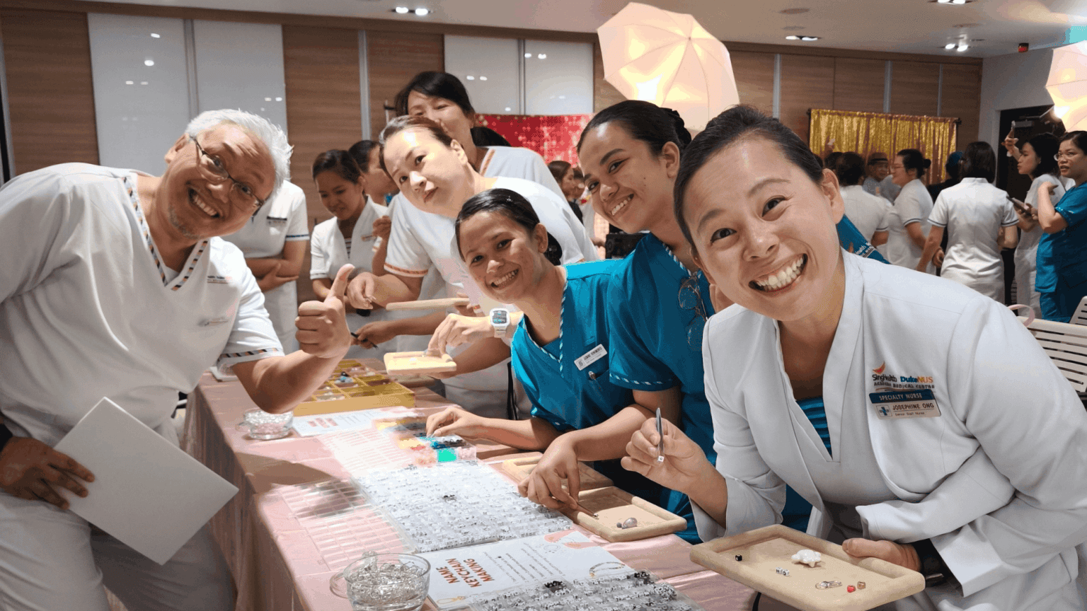 indoor-team-building-singapore-keychain-craft-workshop Indoor team building workshop in Singapore with healthcare staff making keychains